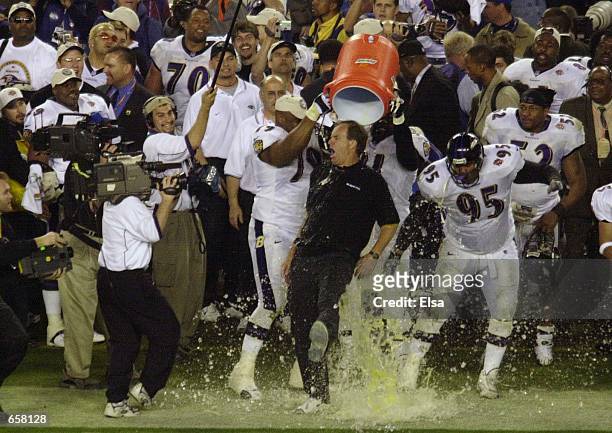Head coach Brian Billick of the Baltimore Ravens is doused with Gatorade in the final seconds against the New York Giants during Super Bowl XXXV at...