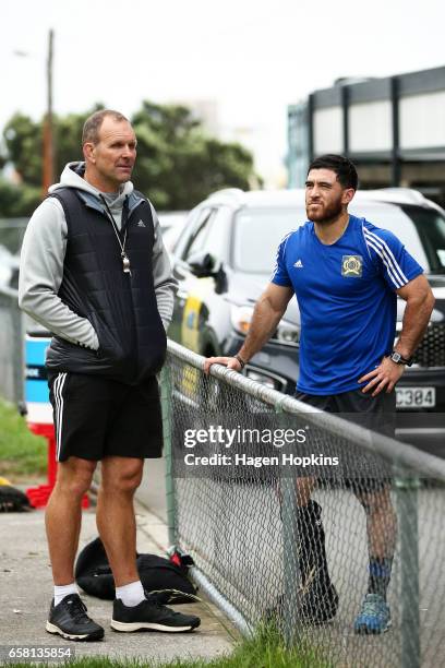 Assistant Coach John Plumtree talks to an injured Nehe-Milner-Skudder during a Hurricanes training session at Rugby League Park on March 27, 2017 in...
