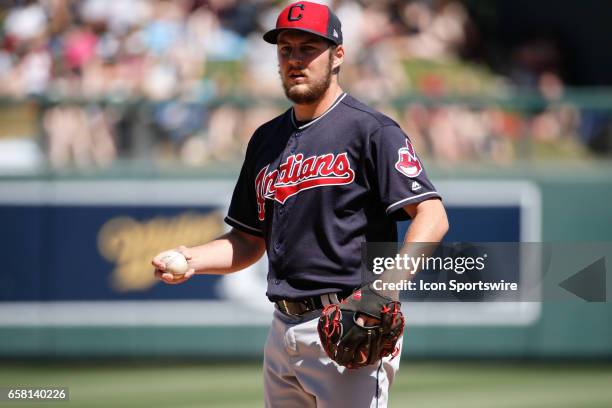 Cleveland Indians starting pitcher Trevor Bauer warms up during the spring training baseball game between the Cleveland Indians and the Arizona...