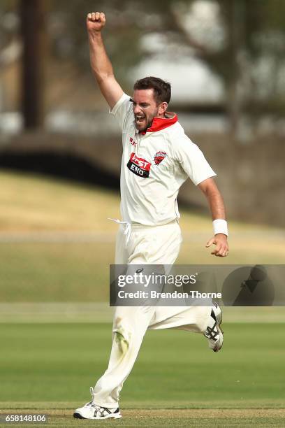 Chadd Sayers of the Redbacks celebrates after claiming the wicket of Jon Holland of the Bushrangers during the Sheffield Shield final between...