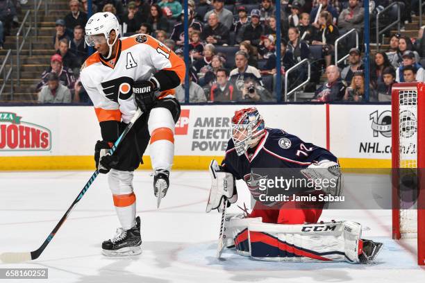 Goaltender Sergei Bobrovsky of the Columbus Blue Jackets defends the net as Wayne Simmonds of the Philadelphia Flyers skates by on March 25, 2017 at...