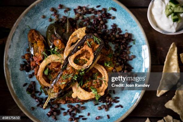 aubergine curry with black rice and lentils - black rice stock pictures, royalty-free photos & images