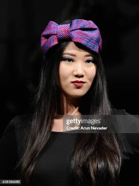 Model walks the runway wearing Hattitude by Christina Lichy at Vancouver Fashion Week Fall/Winter 2017 at Chinese Cultural Centre of Greater...