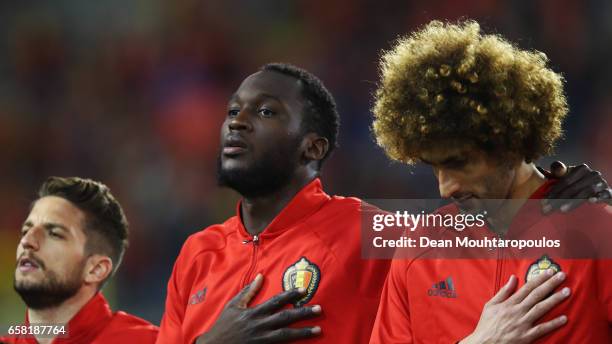 Dries Mertens, Romelu Lukaku and Marouane Fellaini of Belgium stand for the national anthem prior to the FIFA 2018 World Cup Group H Qualifier match...
