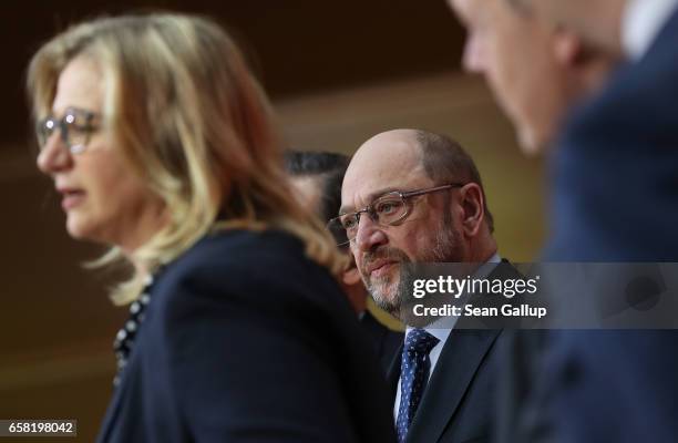 Martin Schulz , newly-elected chairman and chancellor candidate of the German Social Democrats , looks on as Anke Rehlinger, SPD lead candidate in...