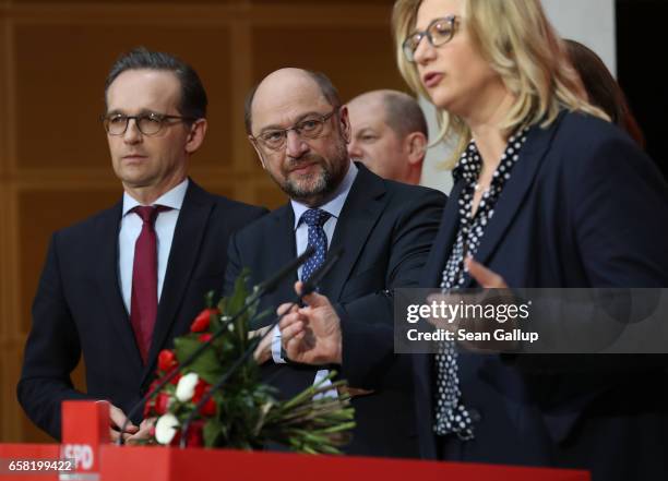 Martin Schulz , newly-elected chairman and chancellor candidate of the German Social Democrats , looks on as Anke Rehlinger, SPD lead candidate in...