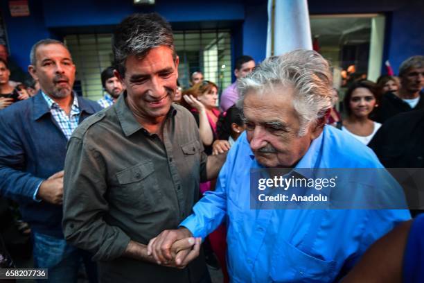 The current vice president of the Republic of Uruguay, Raul Sendic shakes hands with Former president and referent of the left in Uruguay, Jose "Pepe...