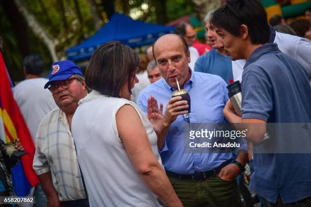 The current Mayor of Montevideo, Daniel Martinez drinks mate, which is a popular drink in Uruguay, as he attends the 46th anniversary celebrations of...