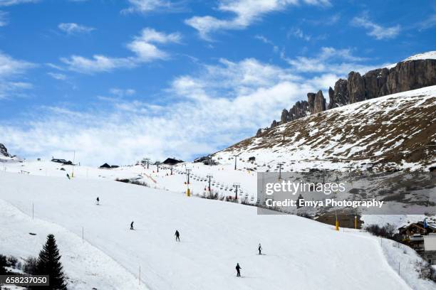 skiing at pordoi pass - fake snow stock pictures, royalty-free photos & images