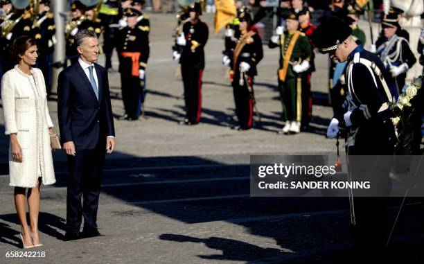 Argentinian president Mauricio Macri and his wife Juliana Awada lay a wreath at the National monument on Dam Square in Amsterdam on March 27, 2017...