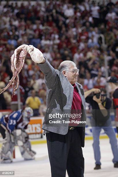 An octopus is picked up off the ice during game seven of the Western Conference finals of the Stanley Cup playoffs between the Detroit Red Wings and...