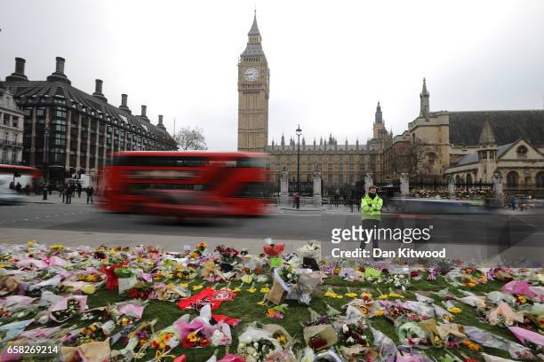 Flowers are left outside the Houses of Parliament in memory of those who died in last weeks Westminster terror attack on March 27, 2017 in London,...