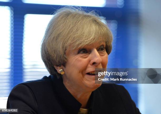 Prime Minister Theresa May talks with officers from Police Scotland about counter-terrorism issues at Govan Police Station on March 27, 2017 in...