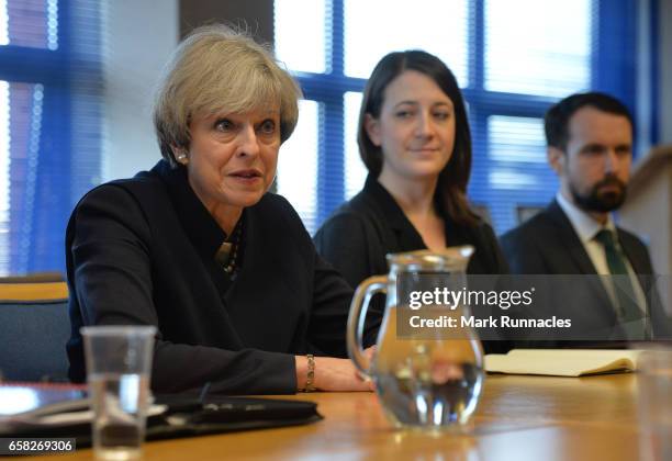 Prime Minister Theresa May talks with officers from Police Scotland about counter-terrorism issues at Govan Police Station on March 27, 2017 in...