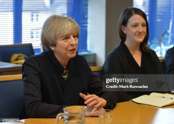 Prime Minister Theresa May talks with officers from Police Scotland about counter-terrorism issues at Govan Police Station on March 27, 2017 in...