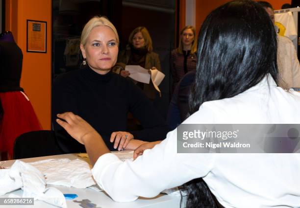 Crown Princess Mette Marit of Norway listens to a woman during a visit to Culture Centre in the Bjerke District on March 27, 2017 in Oslo, Norway.