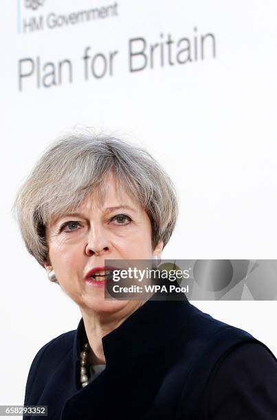 Prime Minister Theresa May delivers a speech at the Department for International Development's office at Abercrombie House on March 27, 2017 in East...