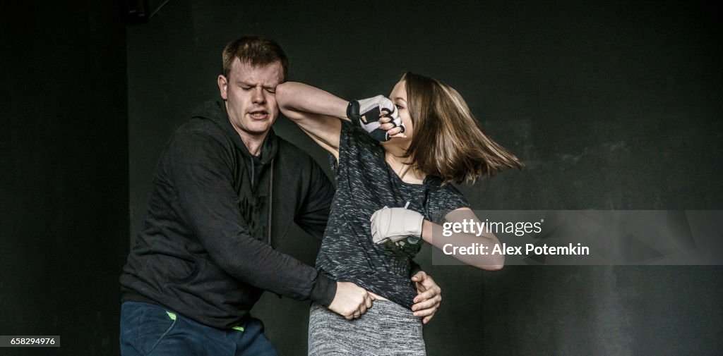 Woman self-defense trick against the man's attack. Strong women practicing self-defense martial art Krav Maga