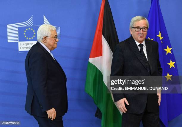 Palestinian President Mahmoud Abbas is welcomed by European Commission President Jean-Claude Juncker at the European Commission in Brussels on March...