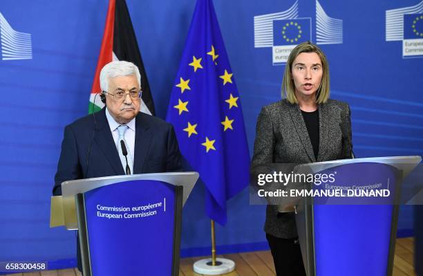 Palestinian President Mahmoud Abbas and EU foreign policy chief Federica Mogherini give a press conference following their meeting at the European...