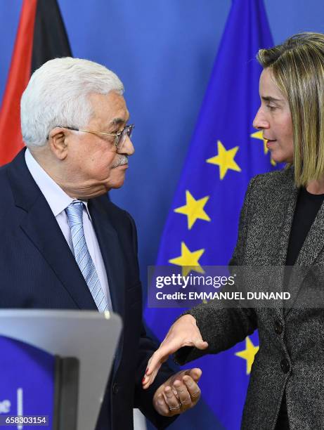 Palestinian President Mahmoud Abbas speaks with EU foreign policy chief Federica Mogherini during a press conference following their meeting at the...