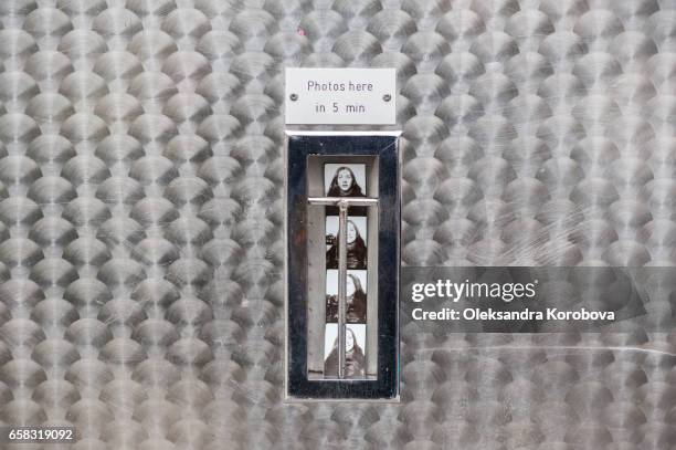 old fashioned photo booth portrait of a young woman taken on the street in berlin, germany. - istock photos stock pictures, royalty-free photos & images