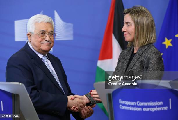 Palestinian President Mahmoud Abbas and High Representative of the European Union for Foreign Affairs and Security Policy Federica Mogherini shake...