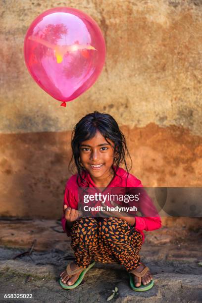 nepalese young happy girl holding baloon, kathmandu - nepal child stock pictures, royalty-free photos & images