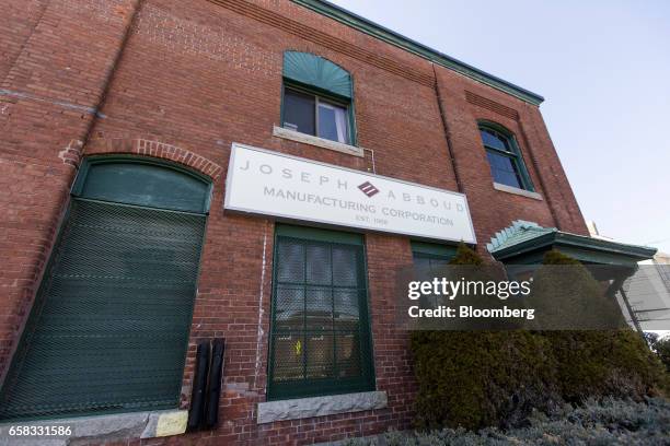 Signage is displayed on the exterior of the Joseph Abboud Manufacturing Corp. Facility in New Bedford, Massachusetts, U.S., on Wednesday, March 22,...