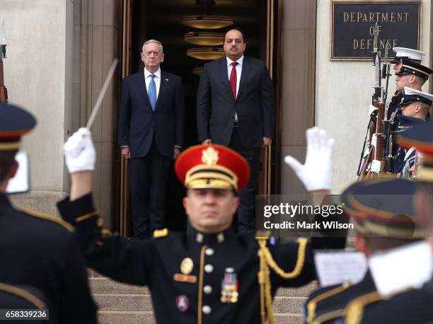 Defense Secretary Jim Mattis welcome's Qatar Minister of State for Defense Affairs Dr. Khalid bin Mohammed al-Attiyah during a honor cordon at the...