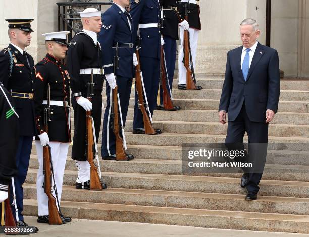 Defense Secretary Jim Mattis prepares to welcome Qatar Minister of State for Defense Affairs Dr. Khalid bin Mohammed al-Attiyah during a honor cordon...