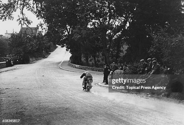 Racing motorcyclist W Newsome riding a Triumph in the Senior Tourist Trophy at the Isle Of Man TT races, 5th July 1911.