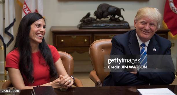 Of Trumbull Unmanned Dyan Gibbens with US President Donald Trump as they participate in a roundtable with women small business owners at the White...