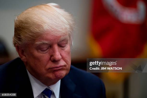 President Donald Trump participates in a roundtable with women small business owners at the White House in Washington, DC, March 27, 2017. / AFP...