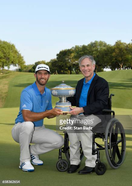 Dustin Johnson and Texas Governor Greg Abbott pose with the Waler Hagen Cup at the World Golf Championships - Dell Technologies Match Play at Austin...