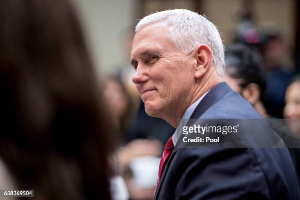 Vice President Mike Pence listens while meeting with women small business owners with U.S. President Donald Trump, in the Roosevelt Room of the White...