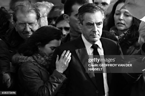 French presidential election candidate for the right-wing Les Republicains party Francois Fillon , stands on stage next to his daughter Marie Fillon...