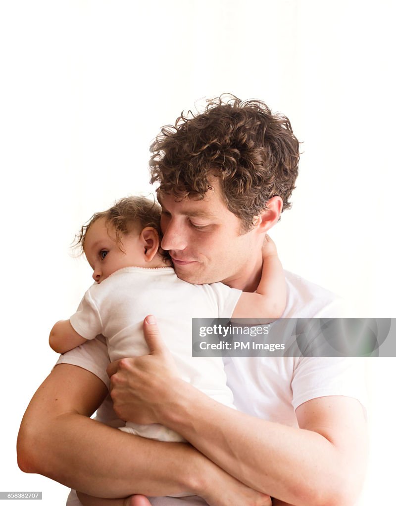 Father holding baby girl