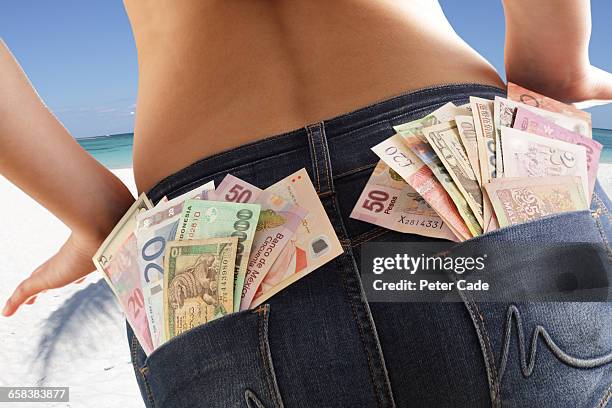 mixed currency in shorts pockets - white pocket stock pictures, royalty-free photos & images