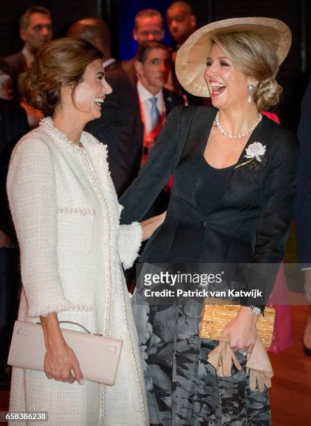 Queen Maxima of The Netherlands and Juliana Awada share a joke as they visit the Hockey Clinics in the Beurs van Berlage on March 27, 2017 in...