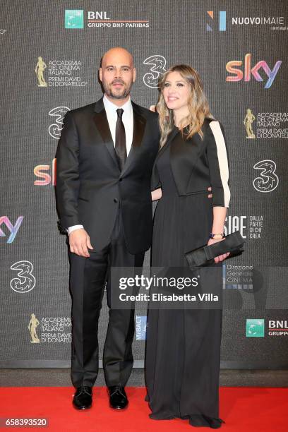 Marco D'Amore and Daniela Maiorana walk the red carpet of the 61. David Di Donatello on March 27, 2017 in Rome, Italy.