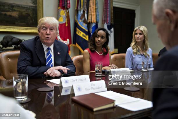 President Donald Trump speaks as U.S. Vice President Mike Pence, from right, Ivanka Trump, daughter of Trump, and Jessica Johnson, president of...