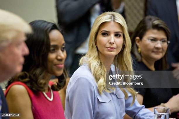 Ivanka Trump, daughter of U.S. President Donald Trump, listens while meeting with Trump, left, and women small business owners in the Roosevelt Room...