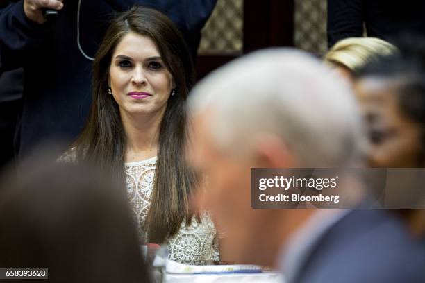 Hope Hicks, White House director of strategic communications, listens while meeting with U.S. President Donald Trump, not pictured, and women small...