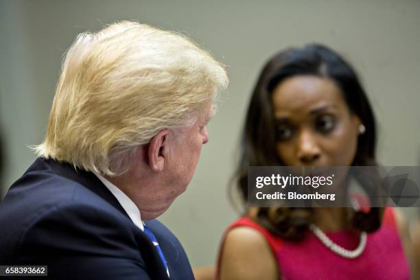 President Donald Trump, left, listens as Jessica Johnson, president of Johnson Security Bureau Inc., speaks during a meeting with women small...