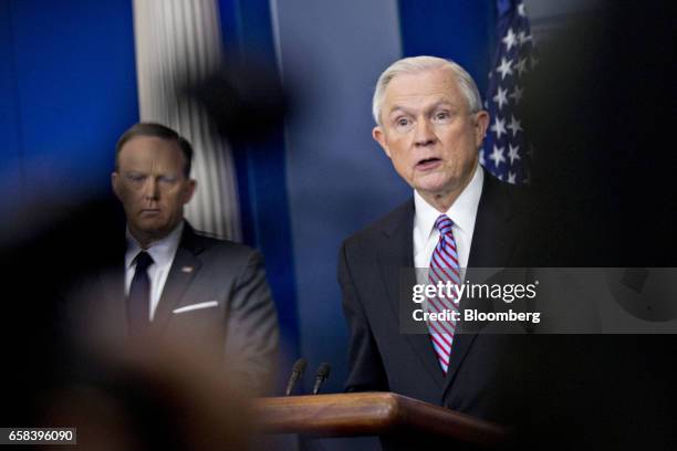 Jeff Sessions, U.S. Attorney general, speaks as Sean Spicer, White House press secretary, left, listens during a White House briefing in Washington,...