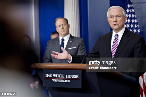 Jeff Sessions, U.S. Attorney general, speaks as Sean Spicer, White House press secretary, left, listens during a White House briefing in Washington,...