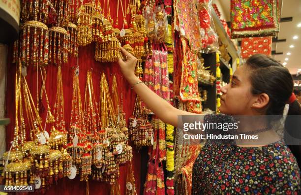 Girl purchasing articles of worship on the eve of Chaitra Navratri on March 27, 2017 at Jalandhar, India.