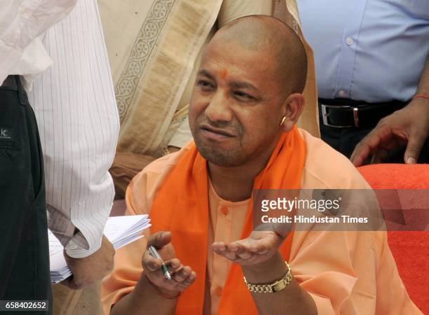 Uttar Pradesh Chief Minister Yogi Adityanath talking to LDA officials during the inspection of Gomti River Front on March 27, 2017 in Lucknow, India....