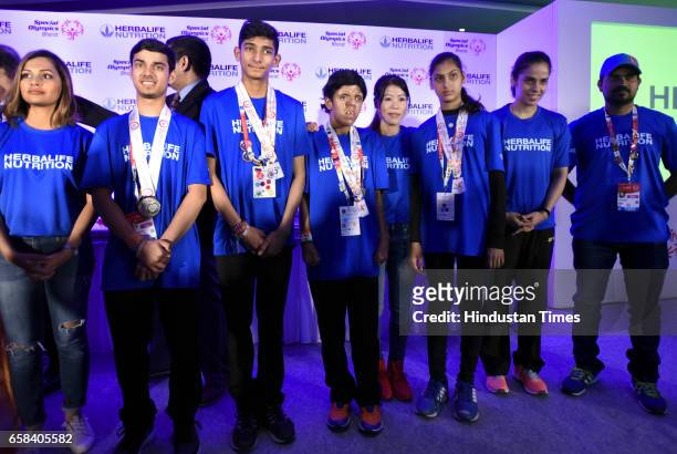 Indian special Olympics athletes win Gold, Silver and bronze medals and meet with Rajya Sabha MP and Boxer Mary Kom, Badminton Player Saina Nehwal,...